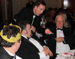 Close up magician Kevin entertains guests at a corporate event with his close up magic and card tricks