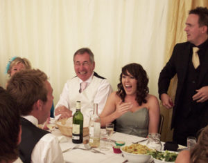 Close up magician causing fits of laughter amongst the wedding guests with his close up magic