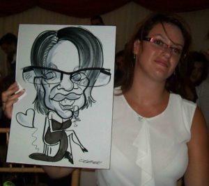 Party Guest Holding a Caricature Drawing Drawn by David our Caricaturist