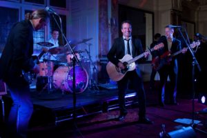 The Dukes Corporate Party Band Playing Live at a Corporate Event Bathed in Blue Light