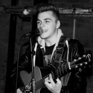 Ben Performing Live Guitar & Vocals Wearing Black Leather Jacket