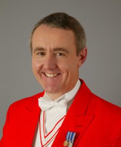 Professional Toastmaster & MC Robert in Full Red Coat Regalia With Medals of Office