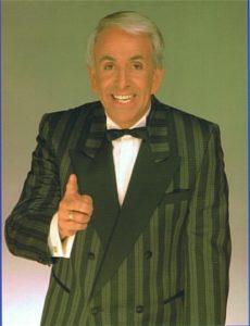 Star Comedian Stand Up and After Dinner Speaker Don Maclean In A Green Striped Jacket Against A Green Background