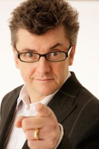 Joe Pasquale Comedian Wearing A Formal Black Jacket