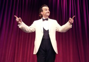 Richard Comedy Master Of Ceremonies In White Tuxedo