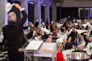 Singing Master Of Ceremonies Audience Participation Waving Napkins In The Air