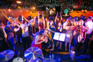 The Party Band Mid Performance Rocking The Crowd