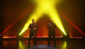 Viva Classical Classical Crossover Duo Bergundy Jackets Red And Yellow Background