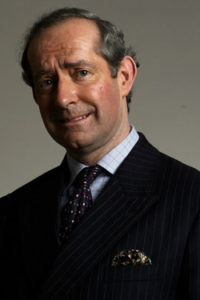 Prince Charles Lookalike Smiling in Typical Royal Pose