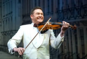 Andy Multi Instrumentalist Playing The Violin On Stage
