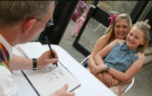 Steve Caricaturist Mum & Child Being Drawn