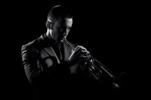 The Jazz Trio Trumpeter Playing A Solo