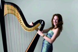 Heather Professional Harpist Posing By Her Black Harp
