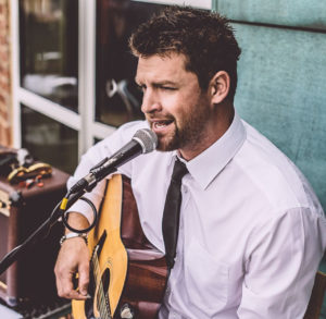 Jay Guitar & Vocals Performing Outdoors For A Corporate Drinks Reception