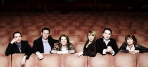 The WestEnders Seated In Theatre Auditorium