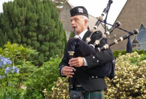 Scottish Bagpiper Andy Playing Outdoors First & Foremost Entertainment Ltd
