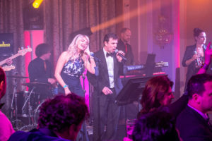 The Bandeoke Experience Male And Female Duo Performing In Front Of The Band First & Foremost Entertainment Ltd